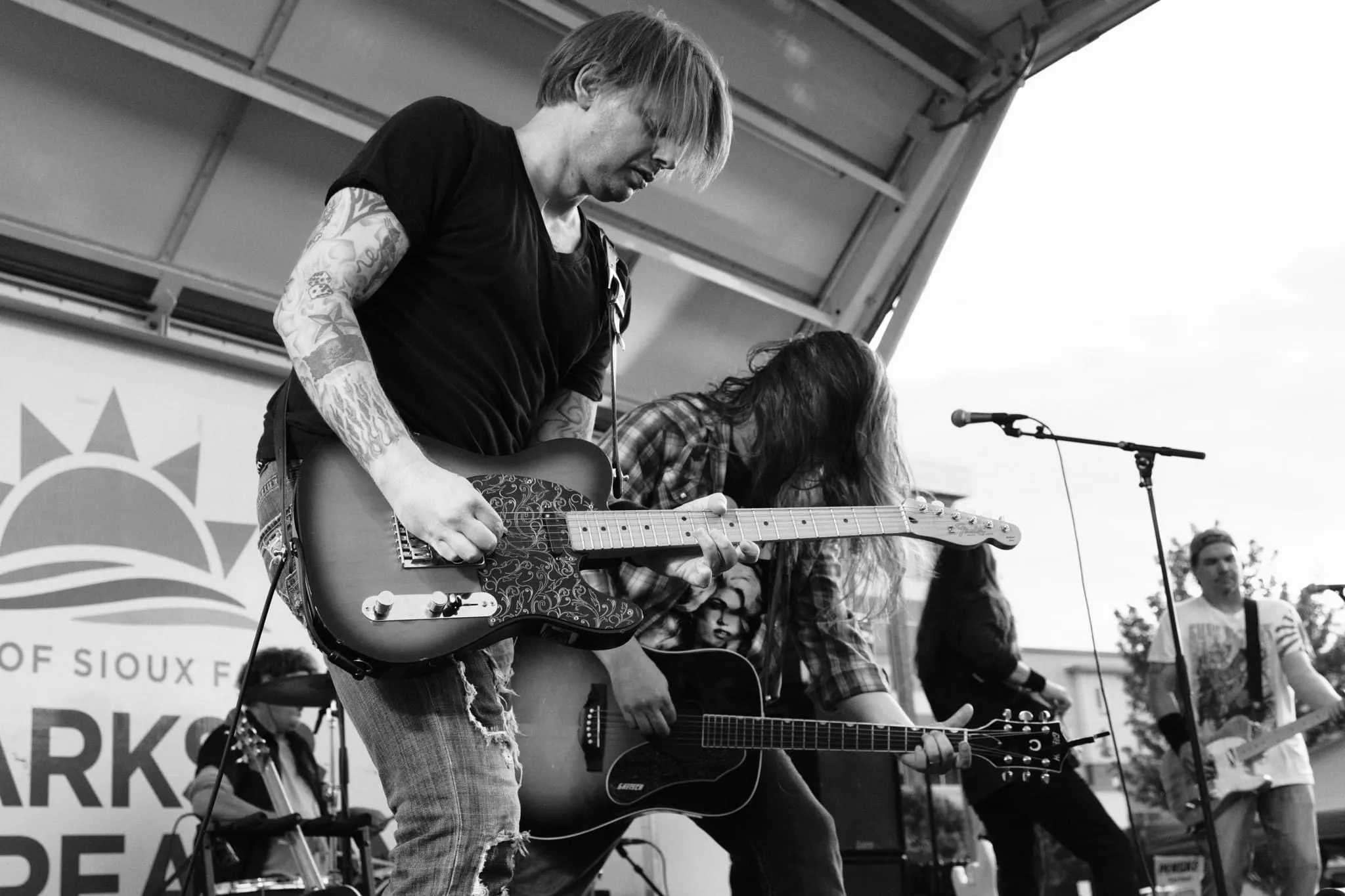 Jason Haven playing guitar with Mat D
