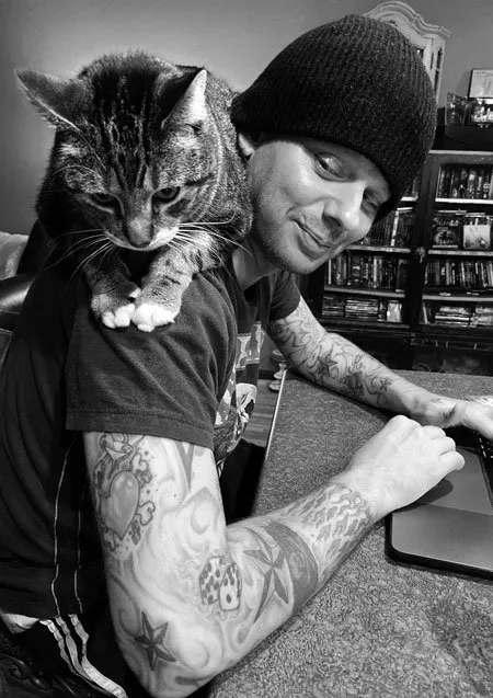 Jason with cat on shoulders